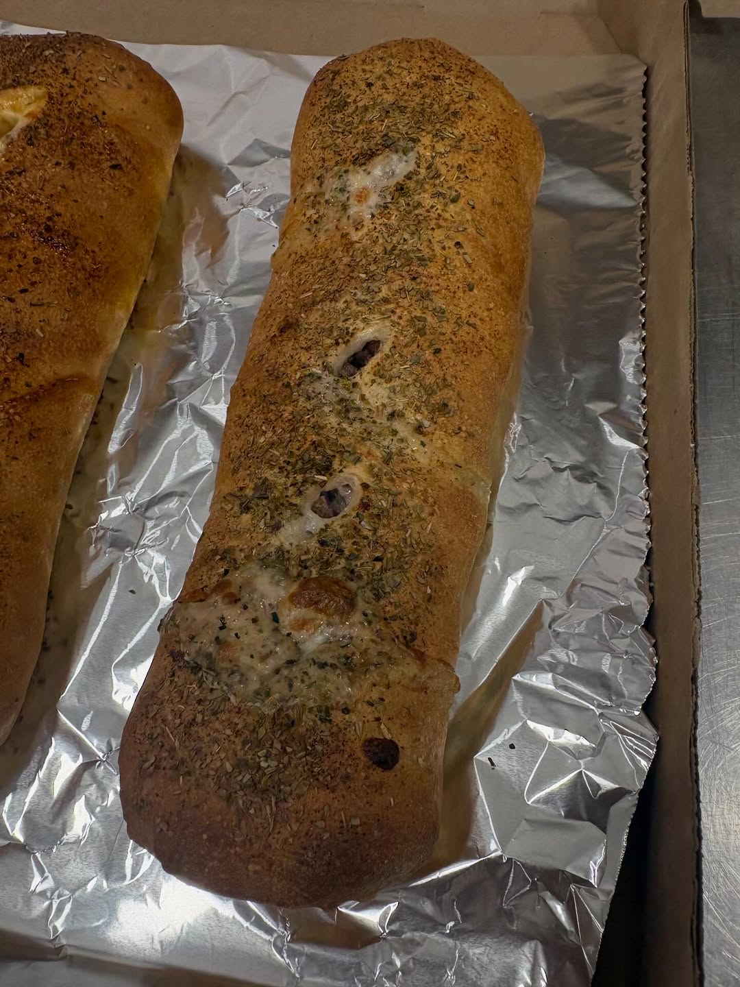 Whole hand-rolled stromboli fresh from the oven